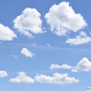 Blue skies with several white cotton-like clouds